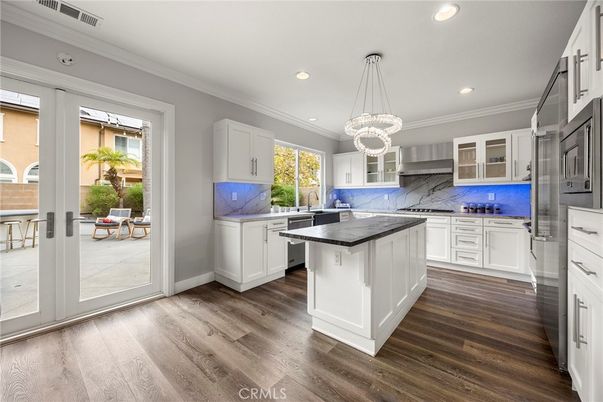 Interior, Kitchen, Marble Walls, Pendant Lights, Recessed Lighting, Wood Texture Flooring