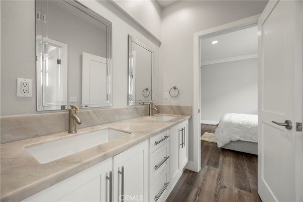 Bathroom, Dual Sink Vanities, Interior, Recessed Lighting, Wood Texture Flooring