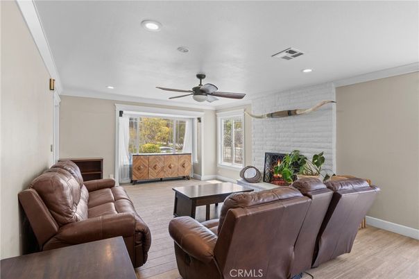 Fireplace, Interior, Living room, Recessed Lighting, Stone Walls, Wood Texture Flooring