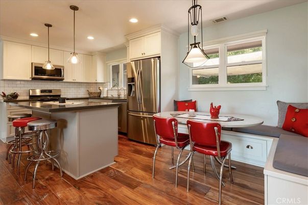 Dining room, Interior, Kitchen, Pendant Lights, Recessed Lighting, Stainless Steel Appliances, Wood Texture Flooring