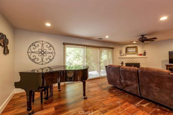 Fireplace, Interior, Living room, Piano, Recessed Lighting, Wood Texture Flooring