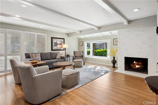 Fireplace, Interior, Living room, Recessed Lighting, Stone Walls, Wood Texture Flooring