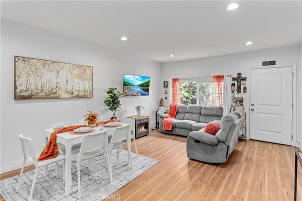 Dining room, Fireplace, Interior, Living room, Recessed Lighting, Wood Texture Flooring