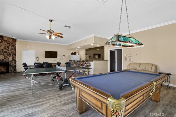Billiard Table, Fireplace, Game Room, Interior, Pendant Lights, Recessed Lighting, Stone Walls, Wood Texture Flooring
