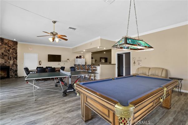 Billiard Table, Fireplace, Game Room, Interior, Pendant Lights, Recessed Lighting, Stone Walls, Wood Texture Flooring