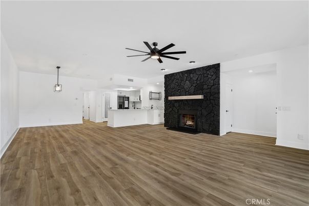 Empty room, Fireplace, Interior, Kitchen, Pendant Lights, Recessed Lighting, Wood Texture Flooring