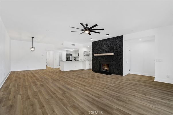 Empty room, Fireplace, Interior, Kitchen, Pendant Lights, Recessed Lighting, Wood Texture Flooring