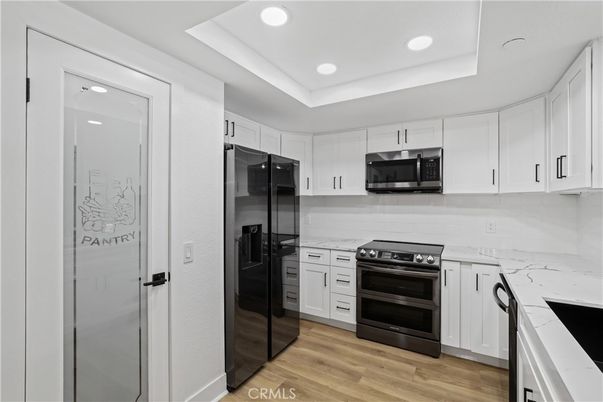 Interior, Kitchen, Recessed Lighting, Stainless Steel Appliances, Wood Texture Flooring
