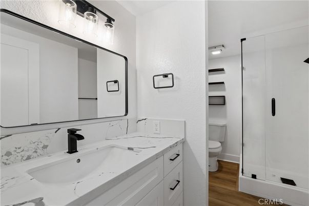 Bathroom, Dual Sink Vanities, Glass Shower, Interior, Wood Texture Flooring