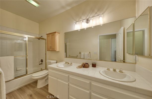 Bathroom, Dual Sink Vanities, Glass Shower, Interior, Tile Countertops, Wood Texture Flooring