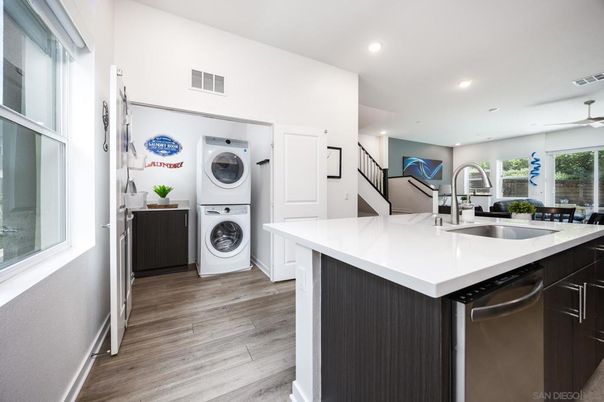 Interior, Kitchen, Recessed Lighting, Washer, Wood Texture Flooring