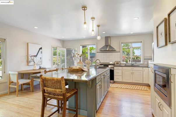 Dining room, Interior, Kitchen, Pendant Lights, Recessed Lighting, Stainless Steel Appliances, Wood Texture Flooring