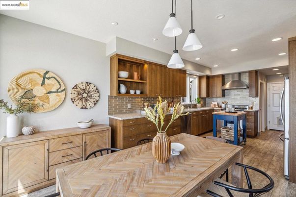 Dining room, Interior, Kitchen, Pendant Lights, Recessed Lighting, Stainless Steel Appliances, Wood Texture Flooring