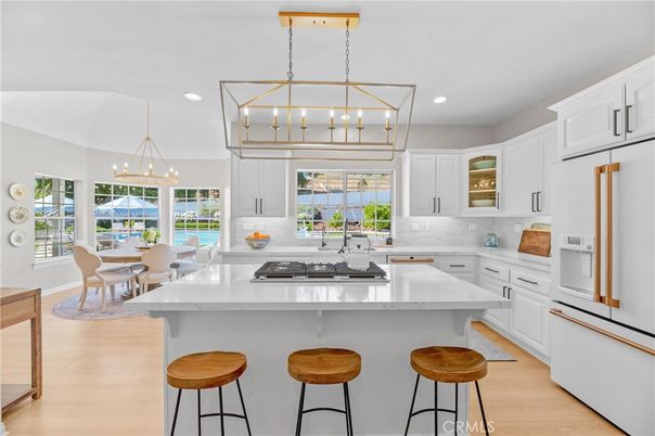 Chandelier, Dining room, Interior, Kitchen, Pendant Lights, Recessed Lighting, Water, Wood Texture Flooring