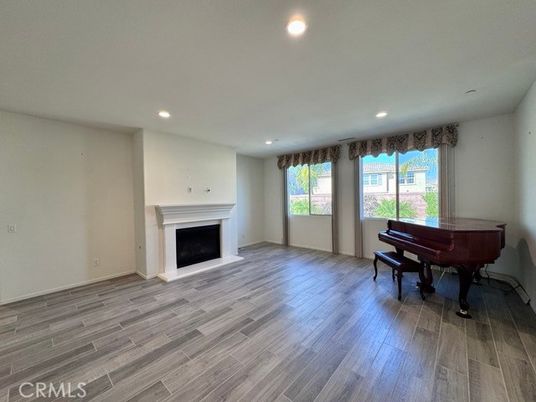 Empty room, Fireplace, Interior, Piano, Recessed Lighting, Wood Texture Flooring