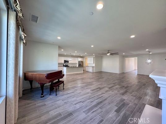 Interior, Kitchen, Pendant Lights, Piano, Recessed Lighting, Stainless Steel Appliances, Wood Texture Flooring