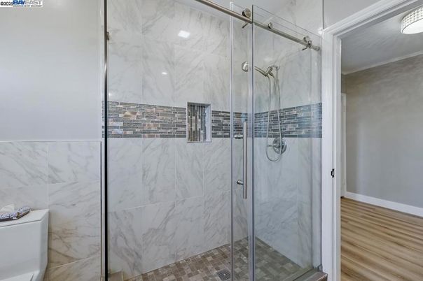 Bathroom, Glass Shower, Interior, Marble Walls, Wood Texture Flooring