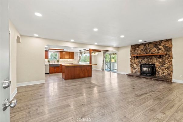 Fireplace, Interior, Kitchen, Recessed Lighting, Stone Walls, Wood Texture Flooring