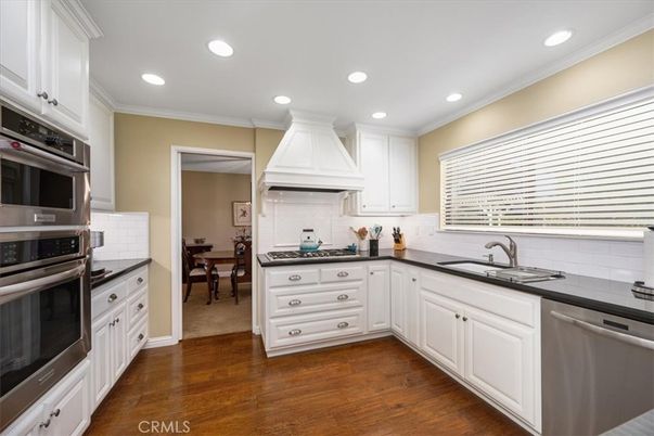 Dining room, Interior, Kitchen, Recessed Lighting, Stainless Steel Appliances, Wood Texture Flooring