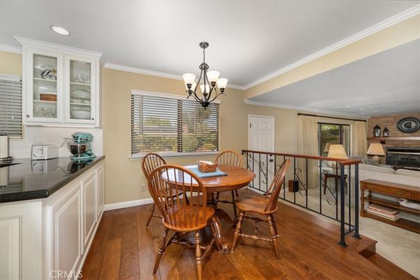Chandelier, Dining room, Fireplace, Interior, Recessed Lighting, Wood Texture Flooring