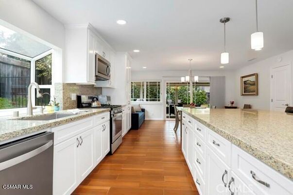 Dining room, Interior, Kitchen, Pendant Lights, Recessed Lighting, Stainless Steel Appliances, Wood Texture Flooring