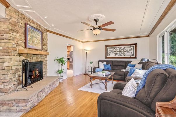 Fireplace, Interior, Living room, Recessed Lighting, Stone Walls, Wood Texture Flooring