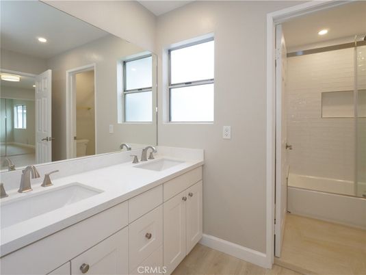 Bathroom, Dual Sink Vanities, Interior, Recessed Lighting, Wood Texture Flooring