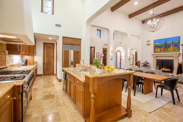 Chandelier, Dining room, Fireplace, Interior, Kitchen, Living room, Pendant Lights, Recessed Lighting, Stainless Steel Appliances, Wooden Beams