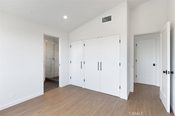 Bathroom, Empty room, Glass Shower, Interior, Recessed Lighting, Wood Texture Flooring