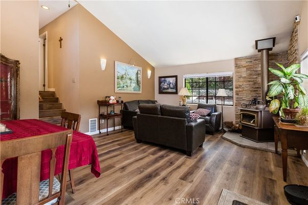 Fireplace, Interior, Living room, Recessed Lighting, Stone Walls, Wood Texture Flooring