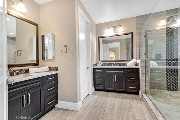 Bathroom, Dual Sink Vanities, Glass Shower, Interior, Tile Countertops, Wood Texture Flooring