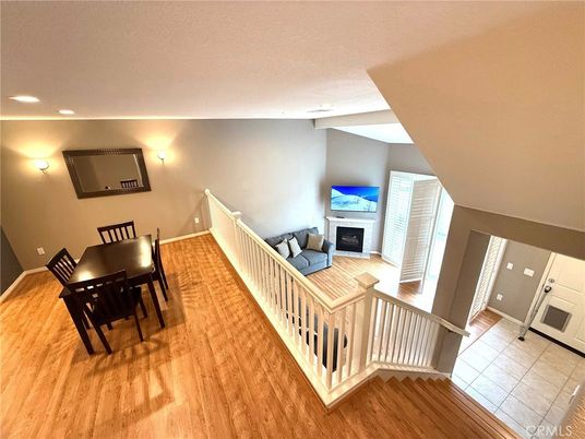 Dining room, Fireplace, Interior, Living room, Recessed Lighting, Wood Texture Flooring