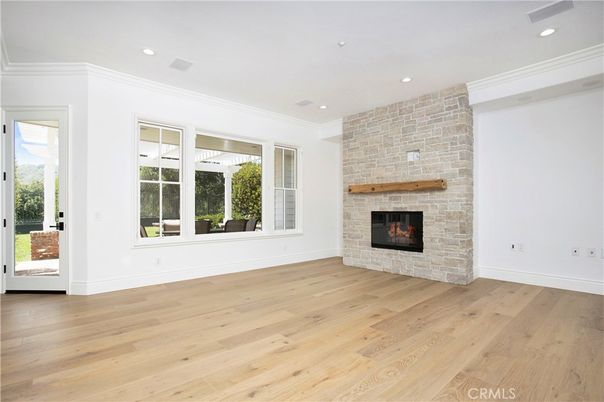 Empty room, Fireplace, Interior, Recessed Lighting, Stone Walls, Wood Texture Flooring