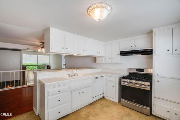 Interior, Kitchen, Stainless Steel Appliances, Tile Countertops, Wood Texture Flooring