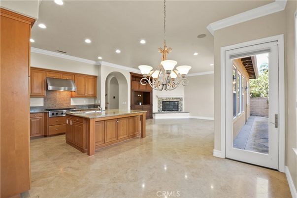 Chandelier, Fireplace, Interior, Kitchen, Recessed Lighting, Stainless Steel Appliances