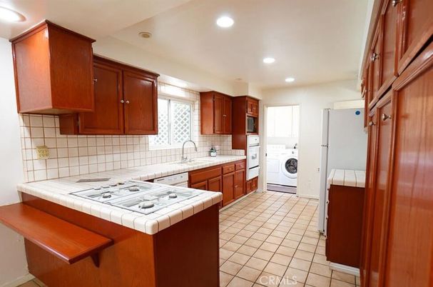 Interior, Kitchen, Recessed Lighting, Tile Countertops, Washer