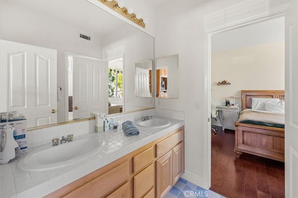 Bathroom, Bedroom, Dual Sink Vanities, Interior, Tile Countertops, Wood Texture Flooring