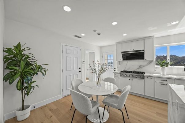Dining room, Interior, Kitchen, Marble Walls, Recessed Lighting, Stainless Steel Appliances, Wood Texture Flooring