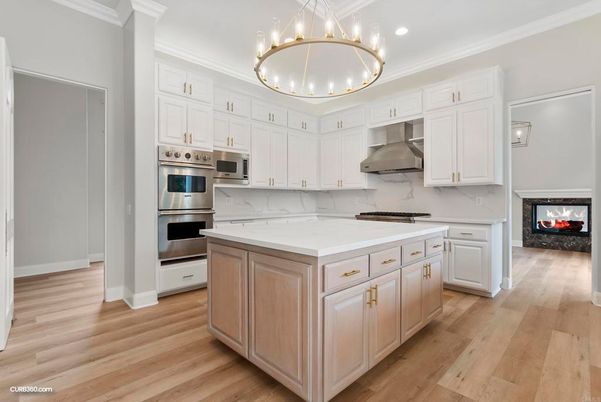 Fireplace, Interior, Kitchen, Marble Walls, Pendant Lights, Recessed Lighting, Stainless Steel Appliances, Wood Texture Flooring