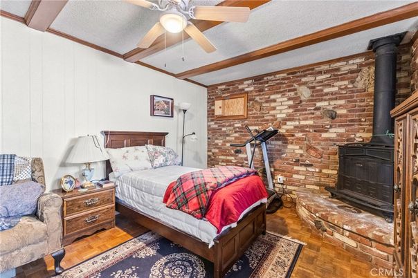Bedroom, Fireplace, Fitness Equipment, Interior, Stone Walls, Wood Texture Flooring