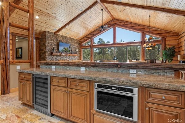 Chandelier, Interior, Kitchen, Pendant Lights, Recessed Lighting, Stainless Steel Appliances, Stone Walls, Wooden Beams, Wooden Ceilings