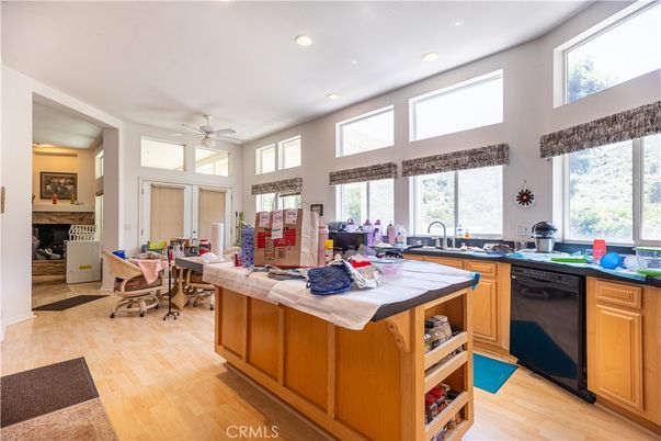 Fireplace, Interior, Kitchen, Recessed Lighting, Tile Countertops, Wood Texture Flooring
