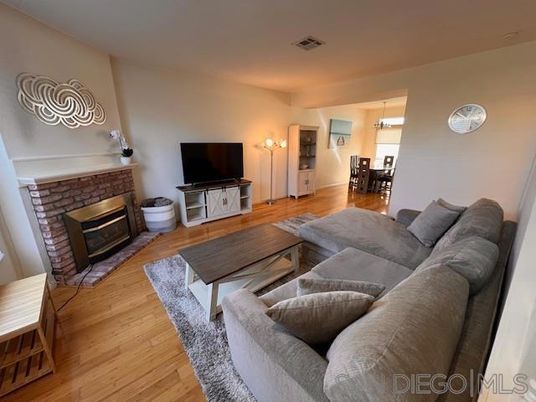 Dining room, Fireplace, Interior, Living room, Pendant Lights, Wood Texture Flooring