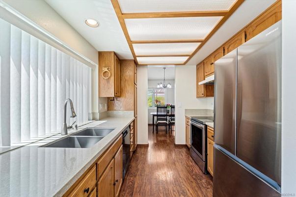 Dining room, Interior, Kitchen, Pendant Lights, Recessed Lighting, Stainless Steel Appliances, Wood Texture Flooring