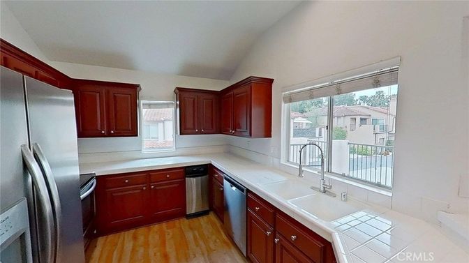 Interior, Kitchen, Stainless Steel Appliances, Tile Countertops, Wood Texture Flooring