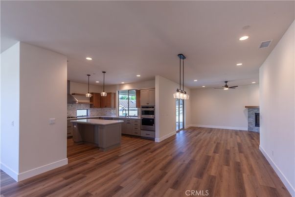 Fireplace, Interior, Kitchen, Pendant Lights, Recessed Lighting, Stainless Steel Appliances, Wood Texture Flooring