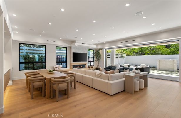 Dining room, Fireplace, Interior, Living room, Recessed Lighting, Wood Texture Flooring