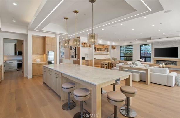 Fireplace, Interior, Kitchen, Living room, Pendant Lights, Recessed Lighting, Stainless Steel Appliances, Wood Texture Flooring