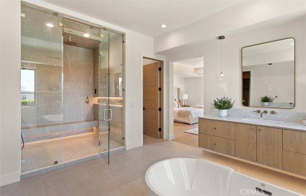 Bathroom, Bedroom, Dual Sink Vanities, Free Standing Baths, Glass Shower, Interior, Pendant Lights, Recessed Lighting, Wood Texture Flooring