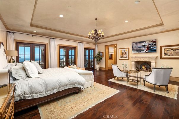 Bedroom, Chandelier, Fireplace, Interior, Recessed Lighting, Wood Texture Flooring